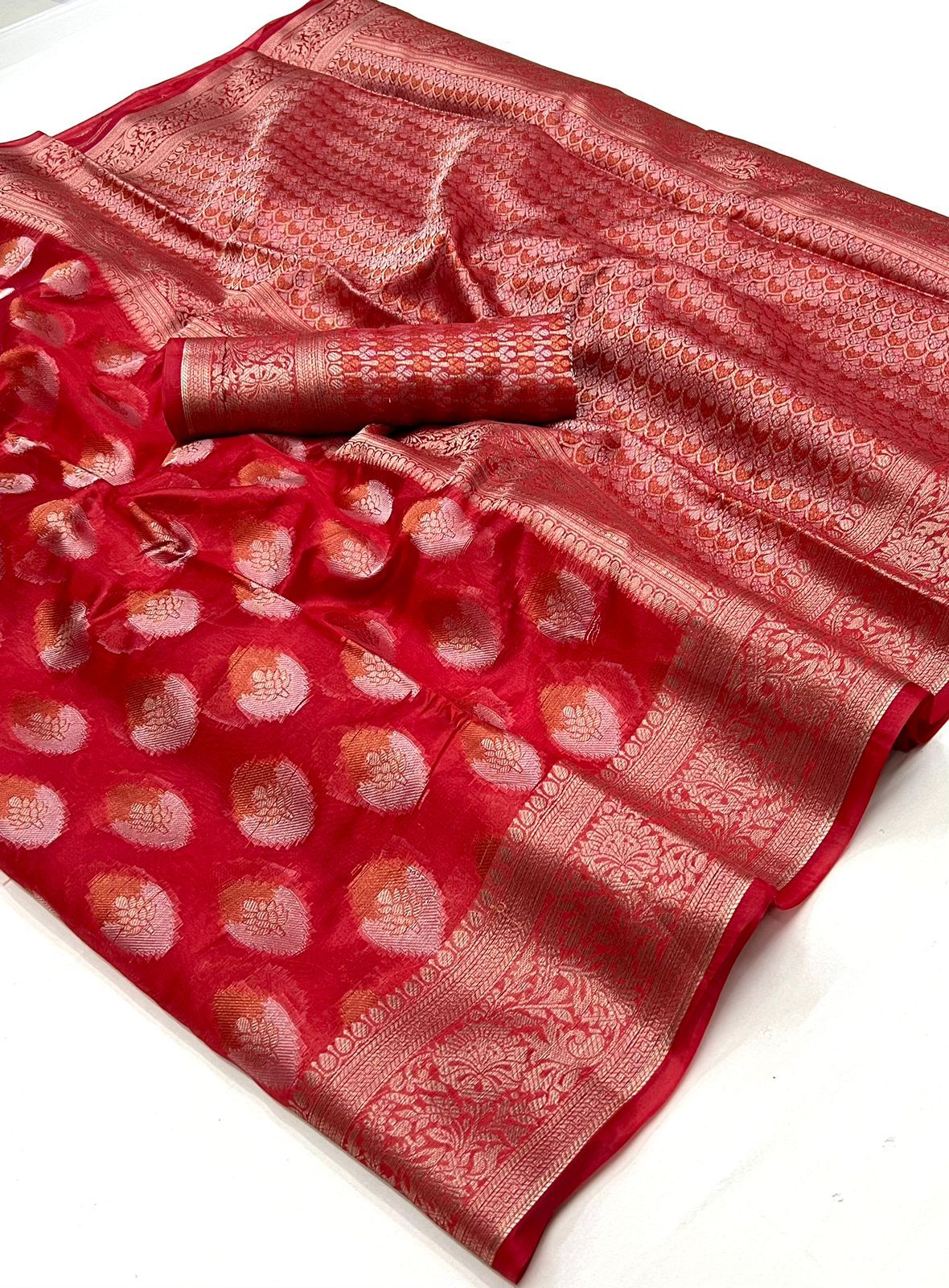 Ruby Red Banarsi Organza Silk Saree with Luxurious Brocade Blouse and Traditional Zari Work