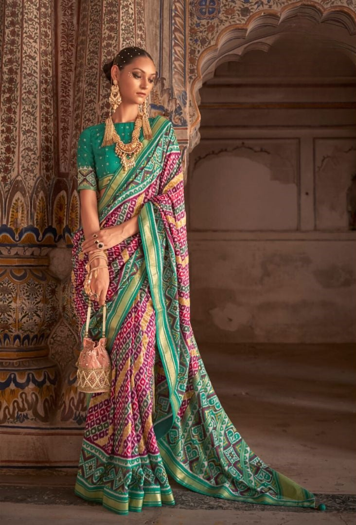 Emerald and Magenta Handwoven Patan Patola Silk Saree with Zari Border and Fancy Latkans
